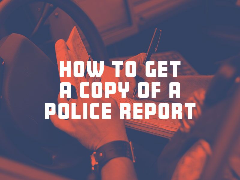 Police officer taking notes after a car collision